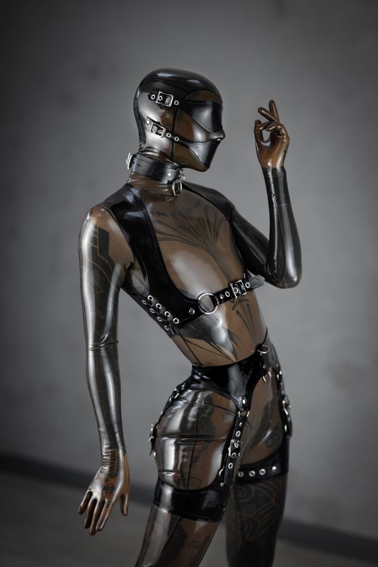 A sexy photograph of Cam Damage in transparent latex. Tagged with: tattoos. Posted June 2019.