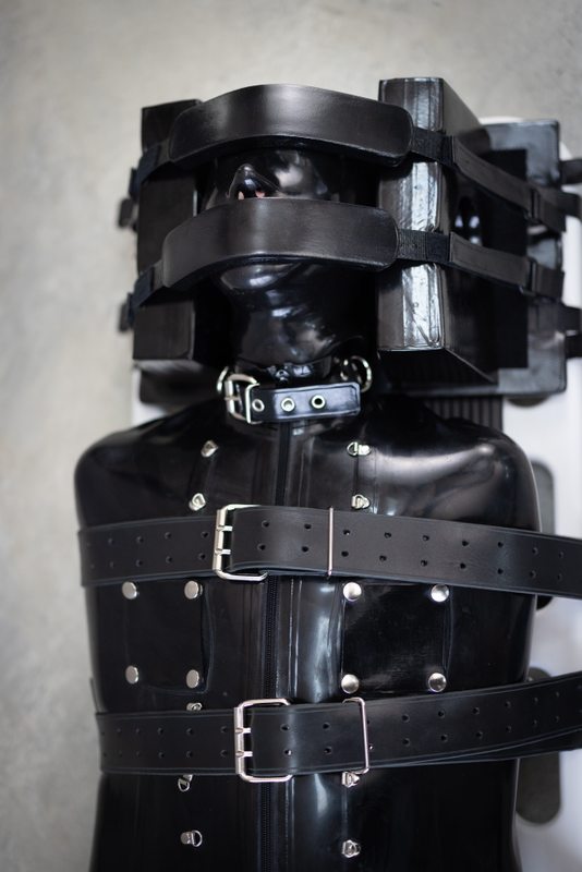 A photo album of Cam Damage & Vespa showing bare skin with black, red, transparent & purple & pink leather. Tagged with: sleepsack, metal bondage, in public, leather, straitjacket, tattoos & vacuum bondage. Posted June 2019.