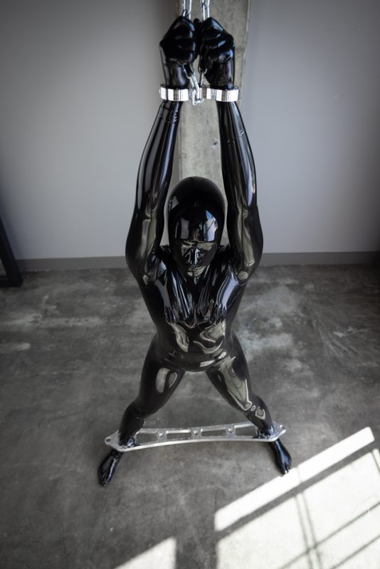 A photo album of Charlee showing bare skin with black leather. Tagged with: muzzle, gasmask, toe socks, metal bondage & leather. Posted June 2021.