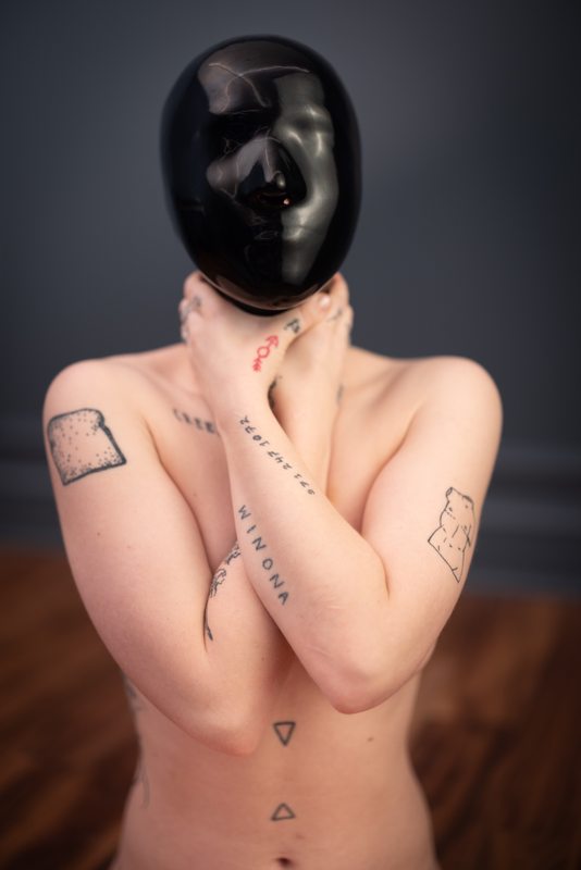 A photo album of Chuck & Vespa in black latex. Tagged with: tattoos, kitten, bondage, gagged, electrical play & vacuum bondage. Posted July 2022.