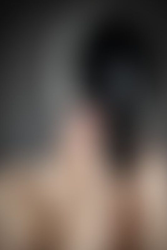 A sexy photograph of Mbot showing bare skin with black latex. Posted October 2019.