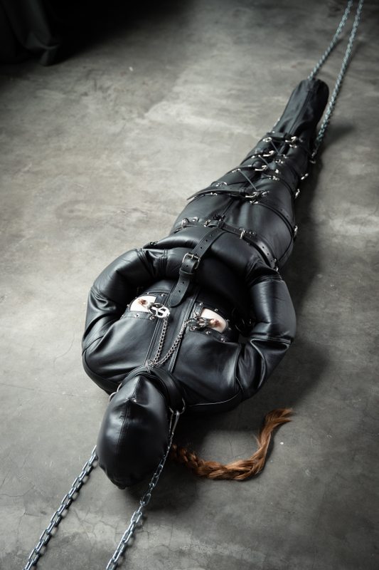 A sexy photograph of Mbot in black leather. Tagged with: leather & straitjacket. Posted October 2019.
