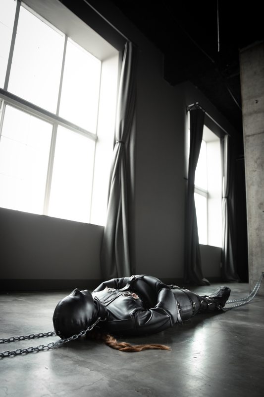 A sexy photograph of Mbot in black leather. Tagged with: leather & straitjacket. Posted July 2020.