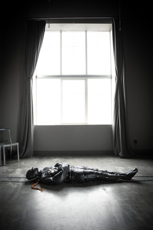 A sexy photograph of Mbot in black leather. Tagged with: leather & straitjacket. Posted October 2019.