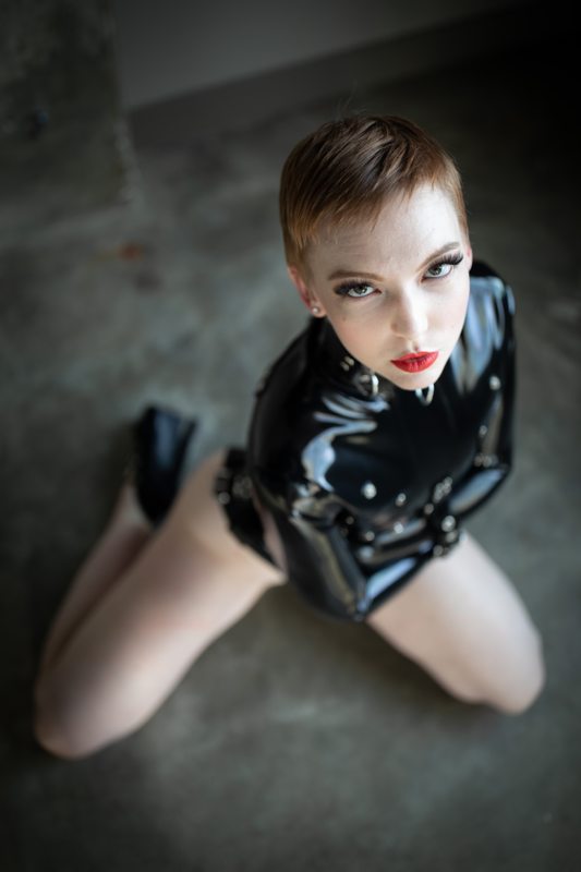 A sexy photograph of Alice, in black latex. Tagged with: straitjacket. Posted January 2020.