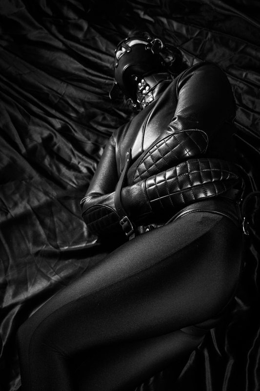 A sexy photograph of Tagged with: gasmask & straitjacket. Posted October 2015.