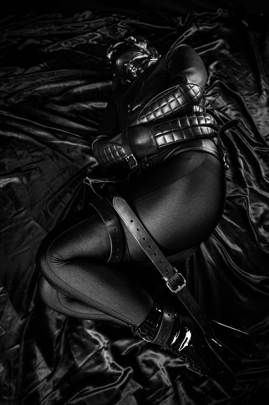 A sexy photograph of Someone. Tagged with: gasmask & straitjacket. Posted October 2015.