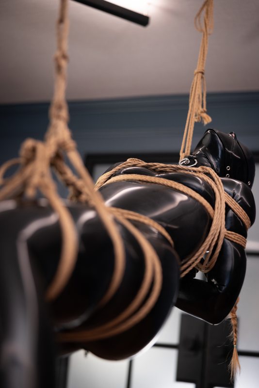 A sexy photograph of Aphrobitey in black latex. Tagged with: rope / shibari. Posted May 2022.
