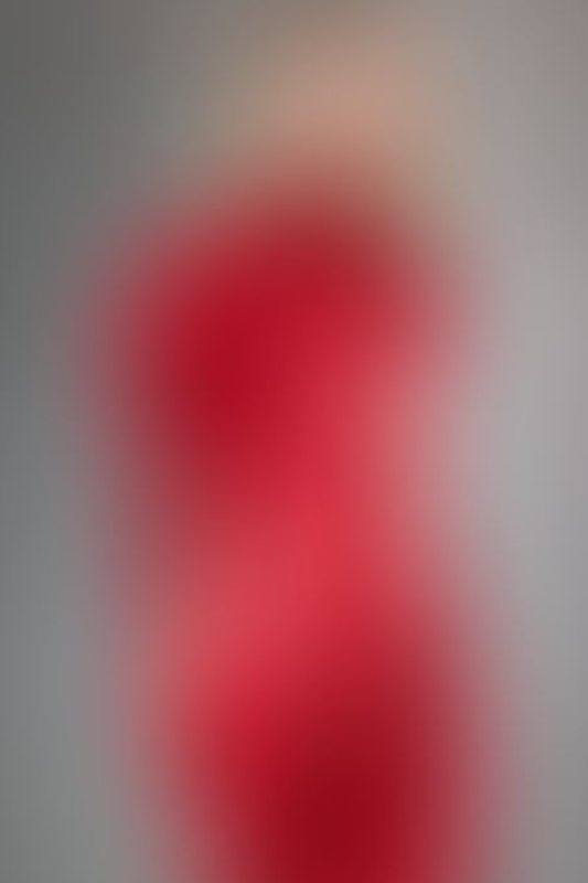 A sexy photograph of Ava Onyx in red latex. Posted August 2023.