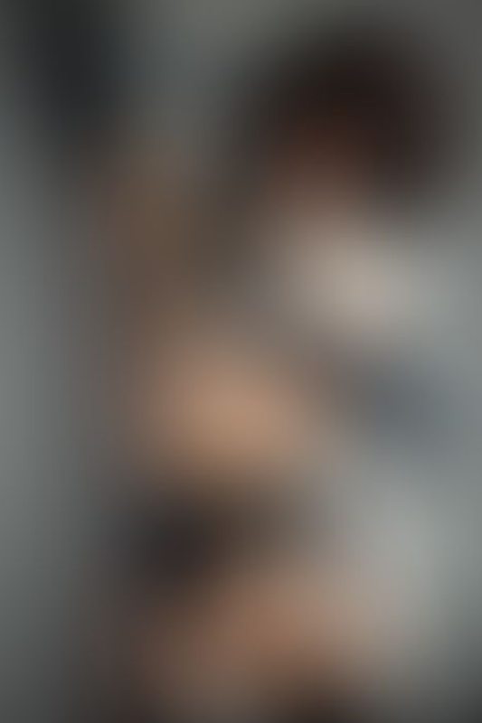 A sexy photograph of Ravyn Alexa showing bare skin with black latex. Posted May 2020.