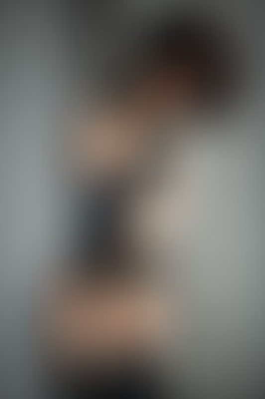 A sexy photograph of Ravyn Alexa showing bare skin with black latex. Posted May 2020.