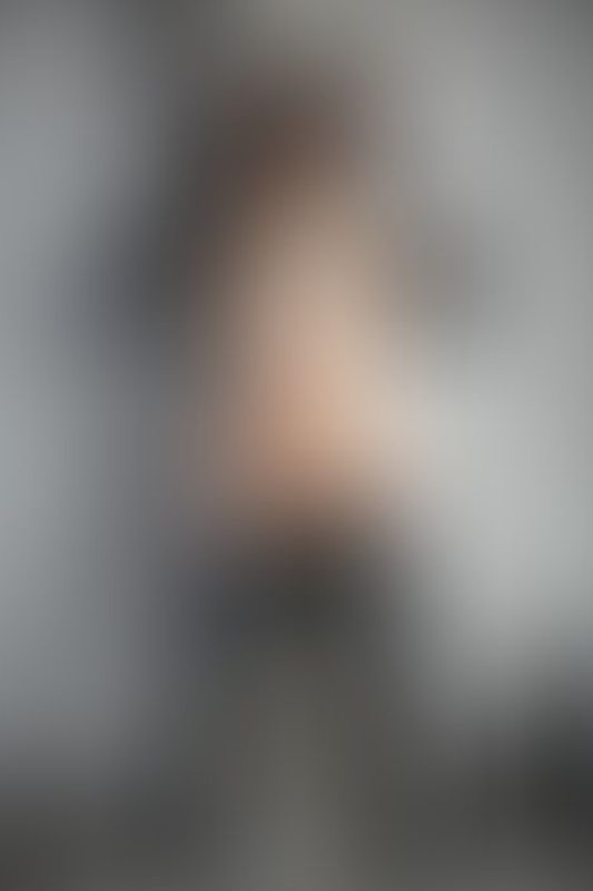 A sexy photograph of Ravyn Alexa showing bare skin with black latex. Posted May 2020.