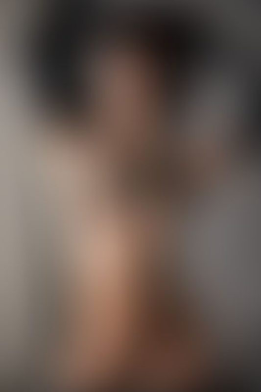 A sexy photograph of Ravyn Alexa showing bare skin with black latex. Posted May 2020.
