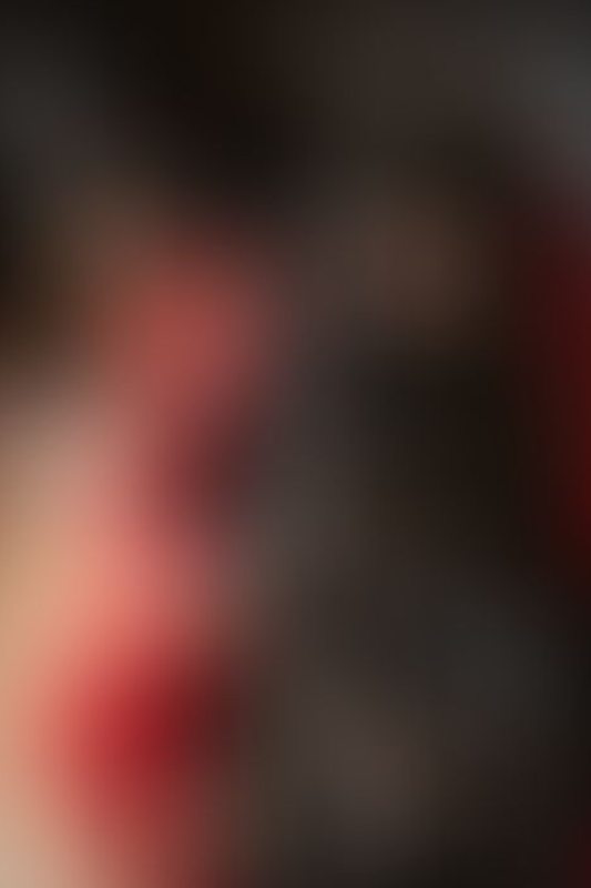 A sexy photograph of Cam Damage &amp; Vespa in black &amp; red latex. Posted December 2019.