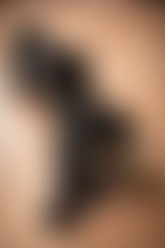 A sexy photograph of Cam Damage in black latex. Posted December 2019.