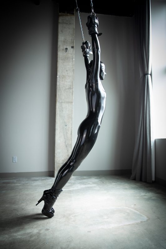 A sexy photograph of Vespa, in black latex. Posted May 2019.