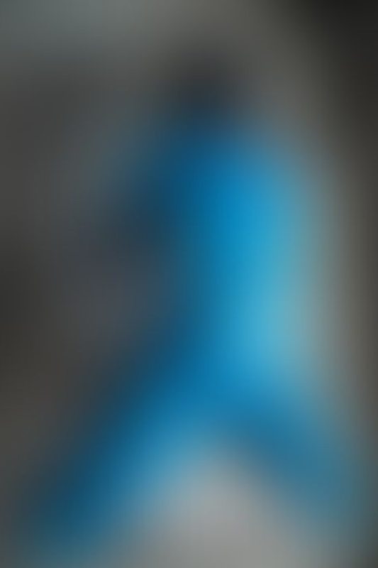 A sexy photograph of Cam Damage in transparent &amp; blue latex. Posted October 2019.