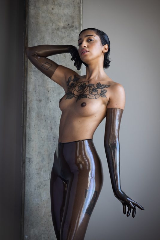 A sexy photograph of Ravyn Alexa showing bare skin with transparent latex. Posted May 2021.