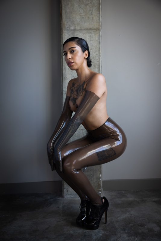 A sexy photograph of Ravyn Alexa, showing bare skin with transparent latex. Posted May 2021.