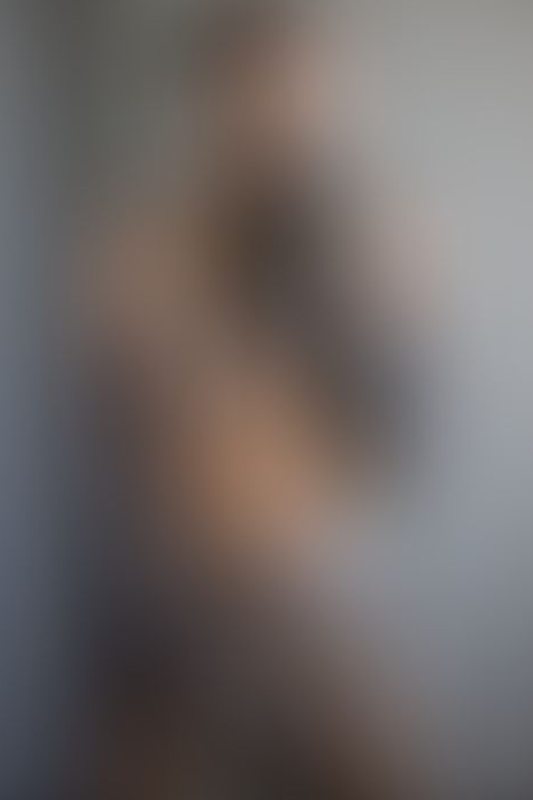 A sexy photograph of Ravyn Alexa showing bare skin with transparent latex. Posted May 2021.