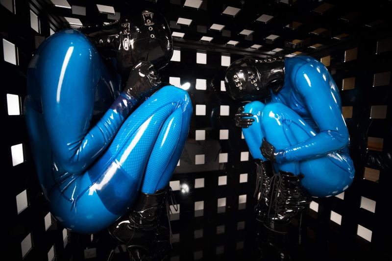A sexy photograph of Vespa & Opal Snow in transparent & blue latex. Posted October 2017.