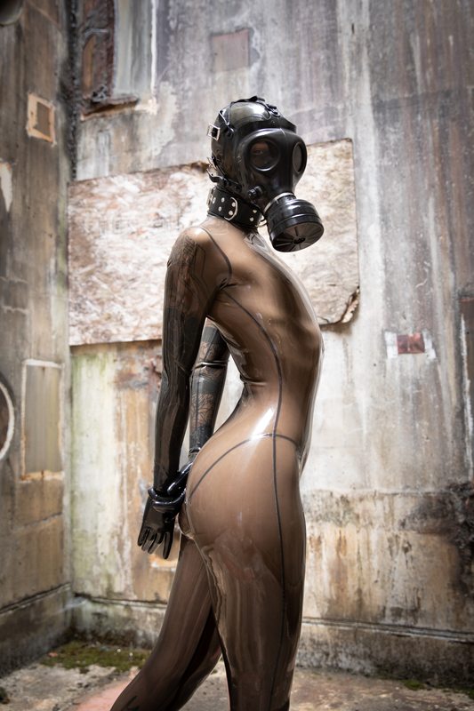 A sexy photograph of Cam Damage, in transparent latex. Tagged with: gasmask. Posted October 2019.