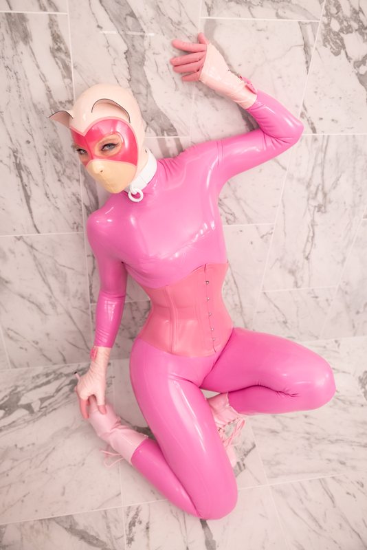 A sexy photograph of Nico in purple & pink latex. Tagged with: kitten. Posted October 2021.