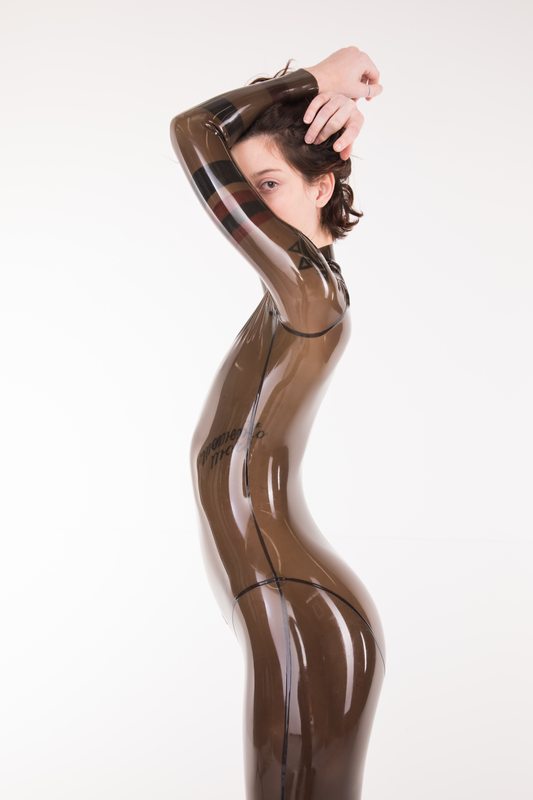 A sexy photograph of Cam Damage in transparent latex. Tagged with: tattoos. Posted March 2018.
