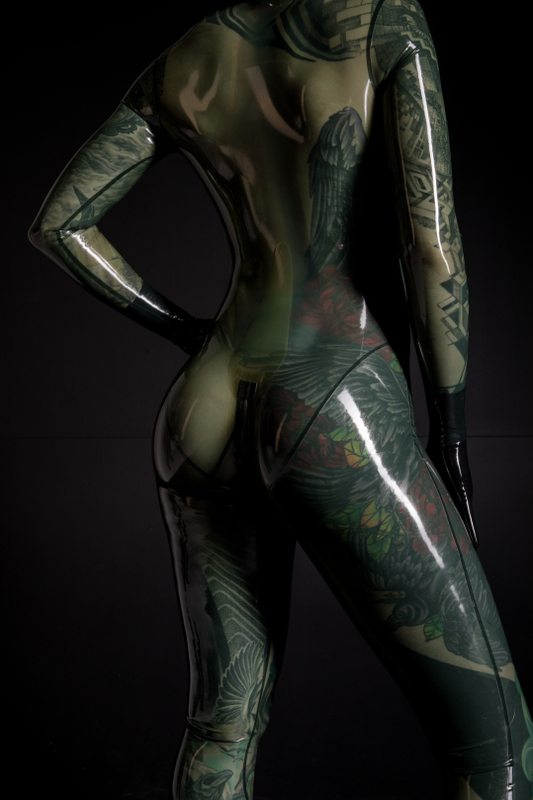 A sexy photograph of Fire Rabbit, in transparent latex. Tagged with: tattoos. Posted March 2018.