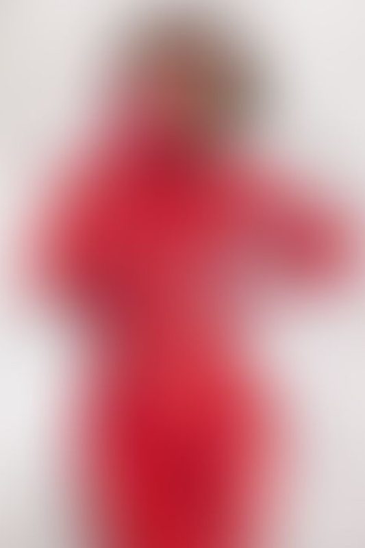 A sexy photograph of Ravyn Alexa in red latex. Posted January 2023.