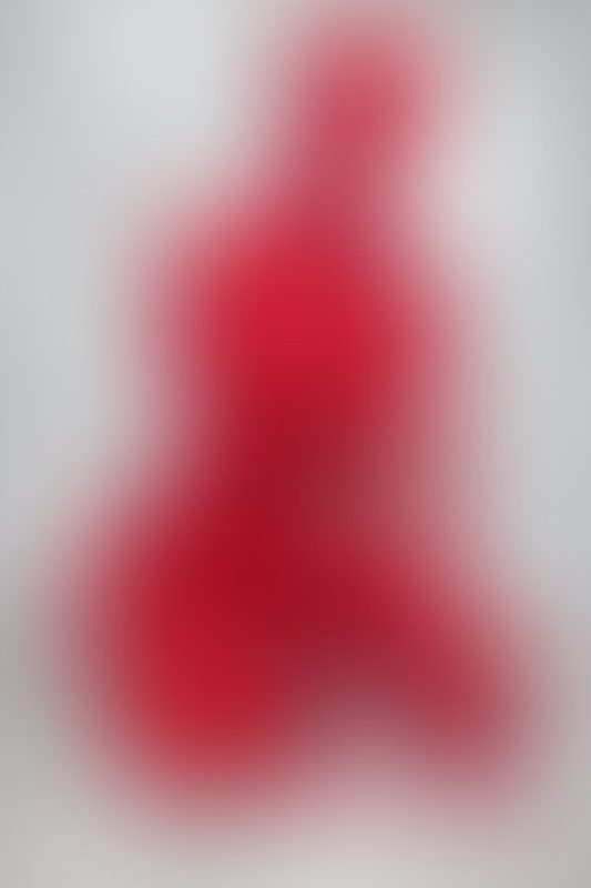 A sexy photograph of Ravyn Alexa in red latex. Posted January 2023.