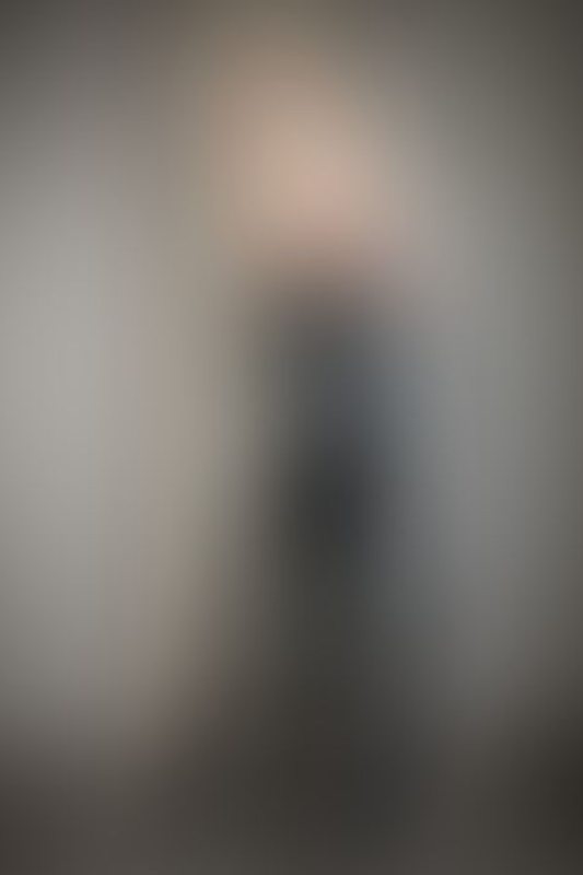 A sexy photograph of Charlee showing bare skin with black latex. Posted June 2021.