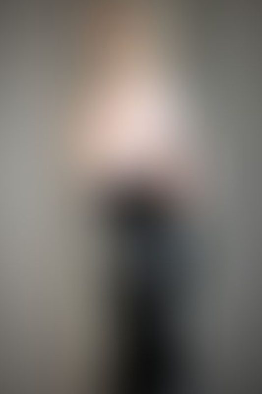 A sexy photograph of Charlee showing bare skin with black latex. Posted June 2021.