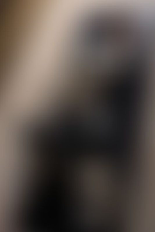 A sexy photograph of Daisy in black latex. Posted June 2025.