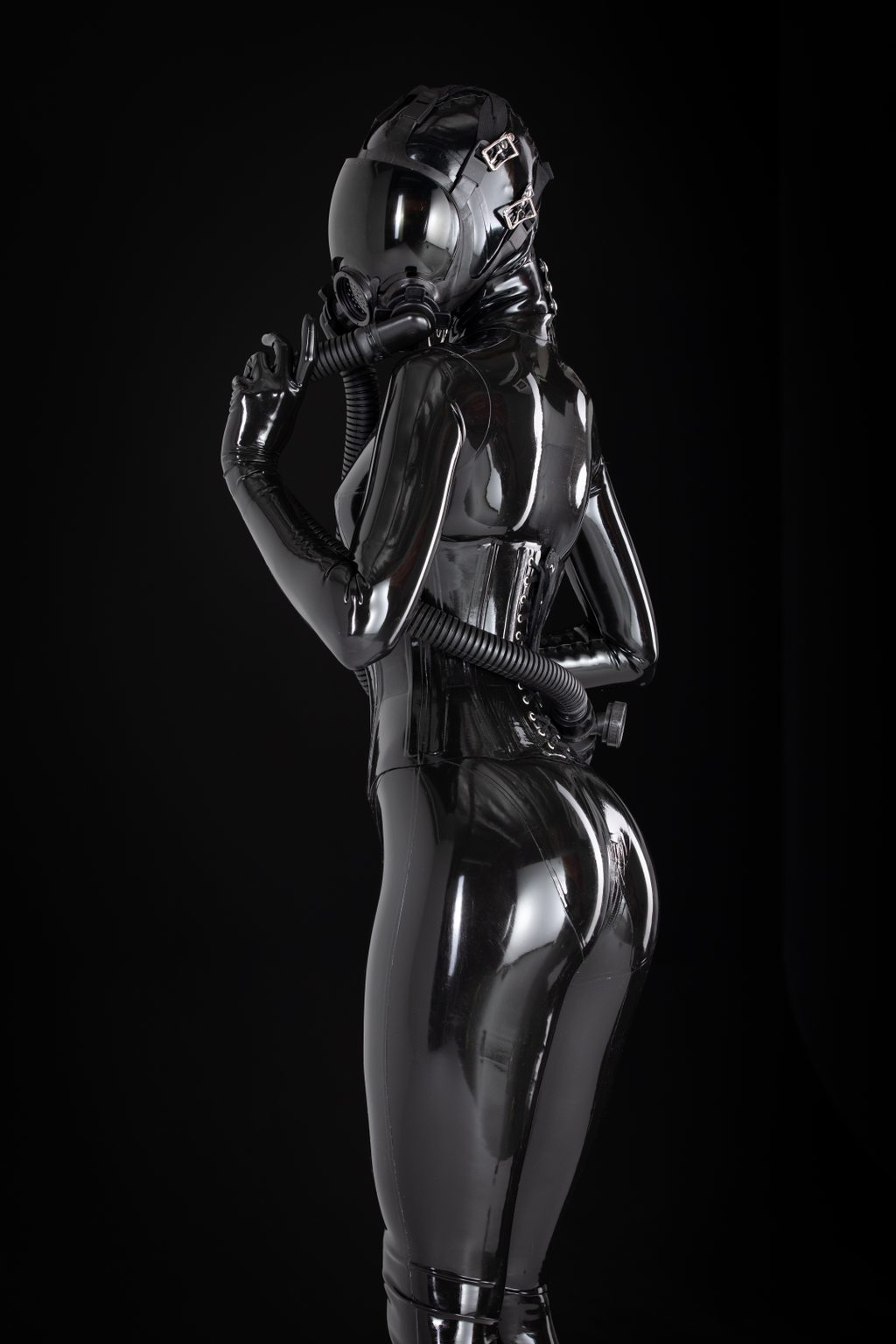 Dark Matter A photo album of Mbot, in black latex. Tagged with: neck corset & gasmask. Posted February 2019.