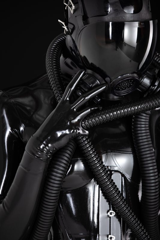 A photo album of Mbot in black latex. Tagged with: neck corset & gasmask. Posted February 2019.