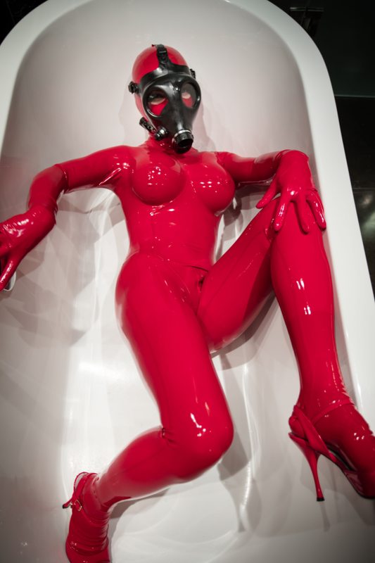 A sexy photograph of Knotasha, in red latex. Tagged with: gasmask. Posted January 2017.
