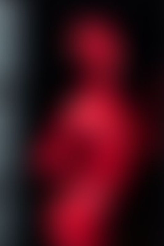 Defiantly Red A sexy photograph of Glossy Toy in red latex. Posted March 2023.