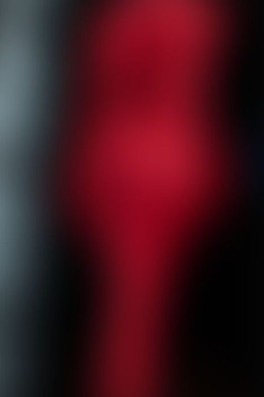 Defiantly Red A sexy photograph of Glossy Toy in red latex. Posted March 2023.