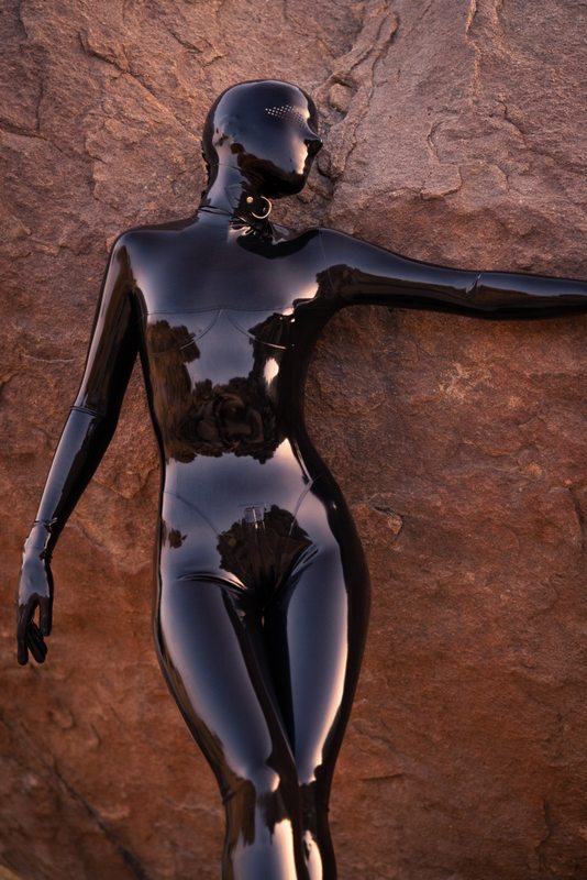 A sexy photograph of Vespa, in black latex. Tagged with: in public. Posted November 2021.