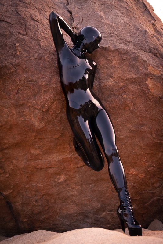 A sexy photograph of Vespa, in black latex. Tagged with: in public. Posted November 2021.