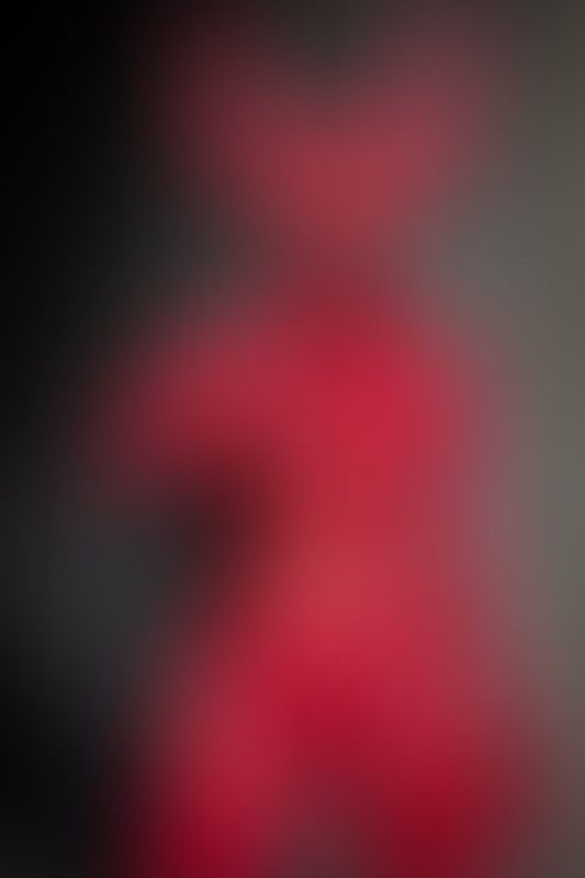 A sexy photograph of Ravyn Alexa in red latex. Posted July 2021.