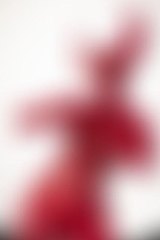 A sexy photograph of Ravyn Alexa in red latex. Posted July 2021.