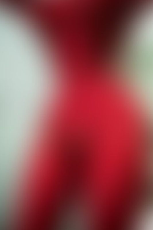 A sexy photograph of Knotasha in red latex. Posted November 2017.