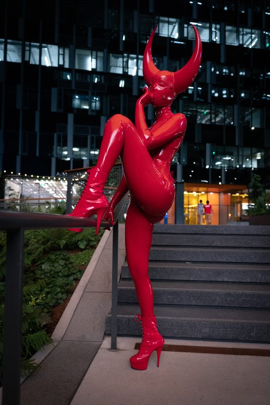 A sexy photograph of Ravyn Alexa in red latex. Tagged with: in public. Posted August 2021.