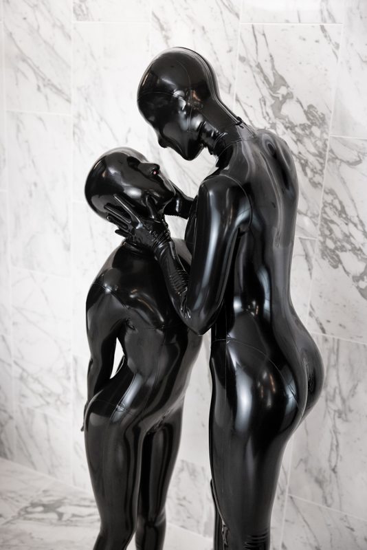 A sexy photograph of Chuck & Vespa in black latex. Posted February 2023.