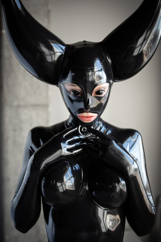 A sexy photograph of Cam Damage, in black latex. Posted July 2020.