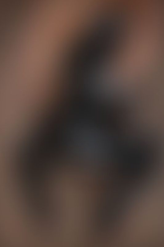 A sexy photograph of Emma Magnolia in black latex. Posted January 2026.