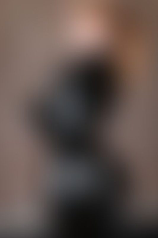 A sexy photograph of Emma Magnolia in black latex. Posted January 2026.