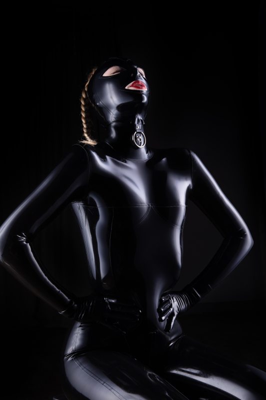 A sexy photograph of Defiantly Yours in black latex. Posted July 2020.